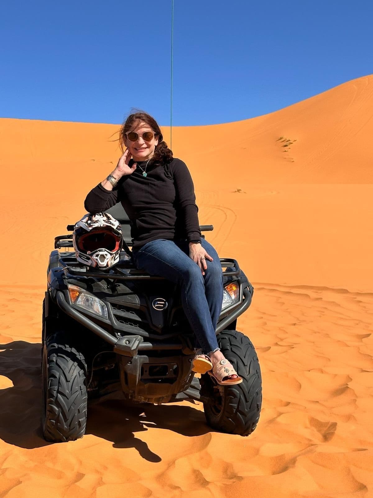 Enlightened Connections CEO in desert in Morocco on RV